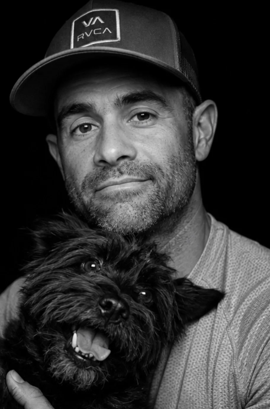 Ben holding Charlie in a studio portrait